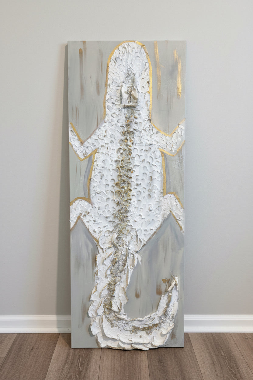 Sculpted ivory alligator painting with gold accents and textured mixed-media details. 