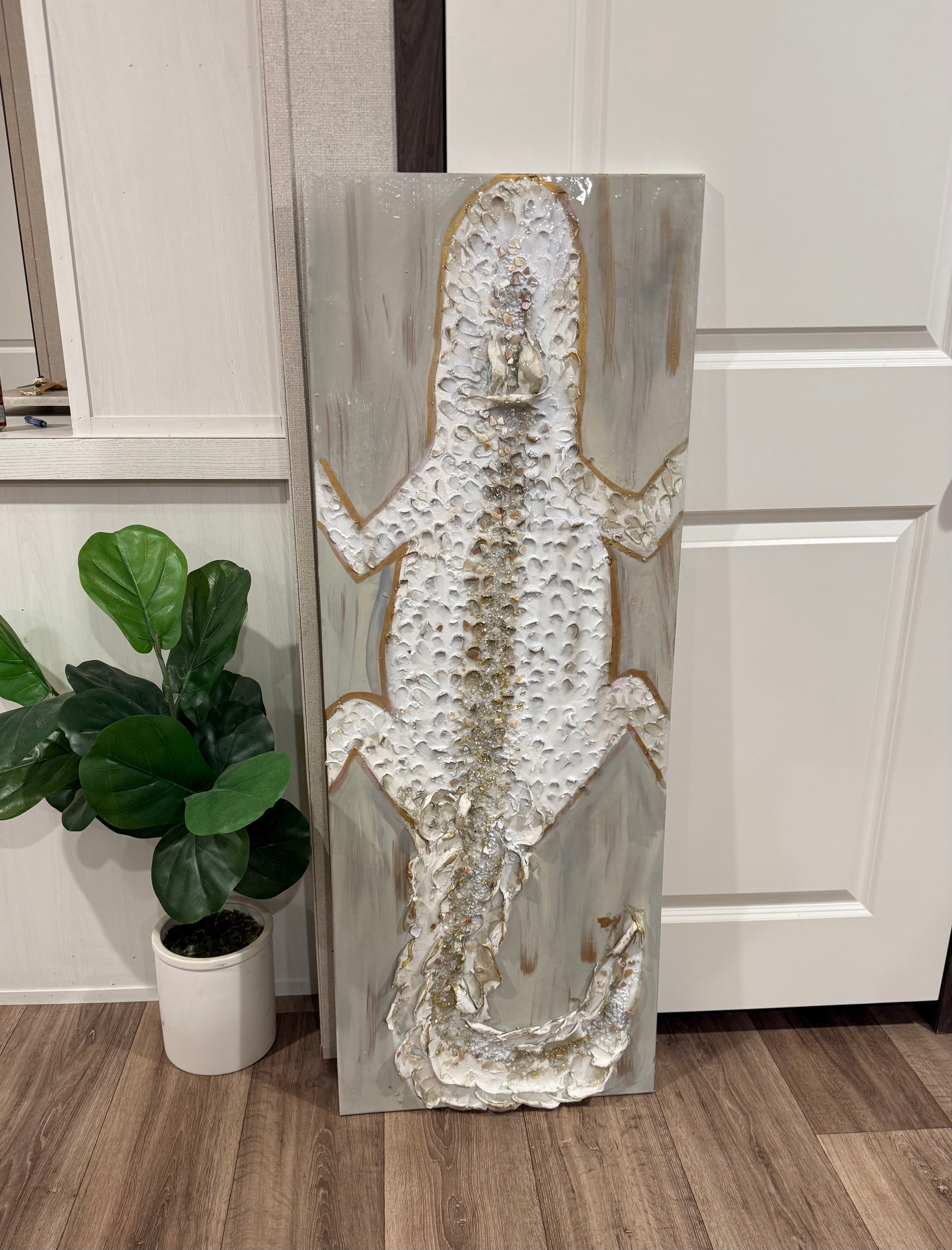 Sculpted ivory alligator painting with gold accents and textured mixed-media details